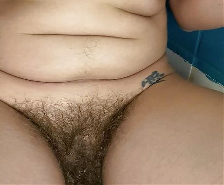 Smoking on the toilet with my hairy pussy showing 